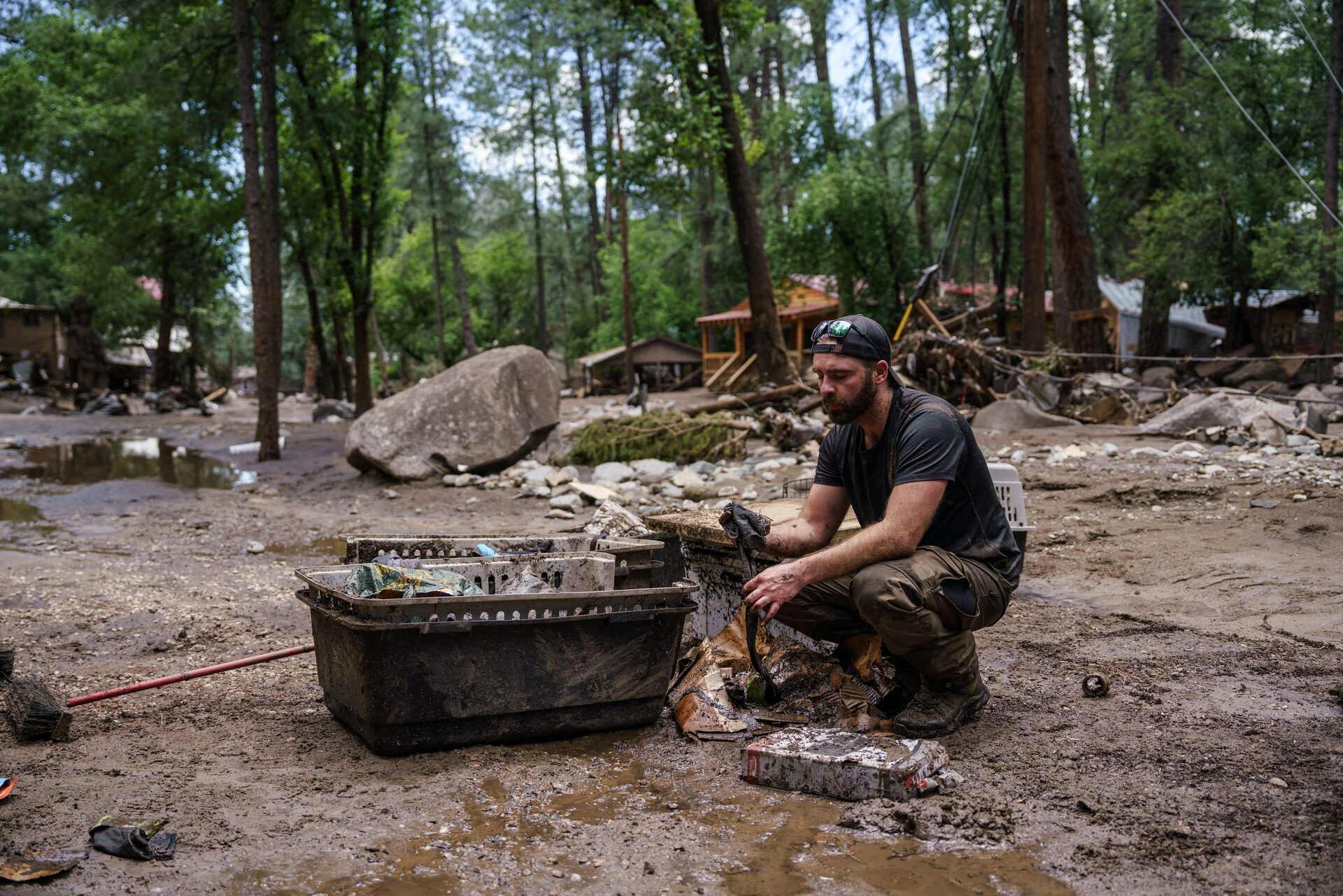 Ruidoso New Mexico community members surveying flood damage and disaster relief efforts